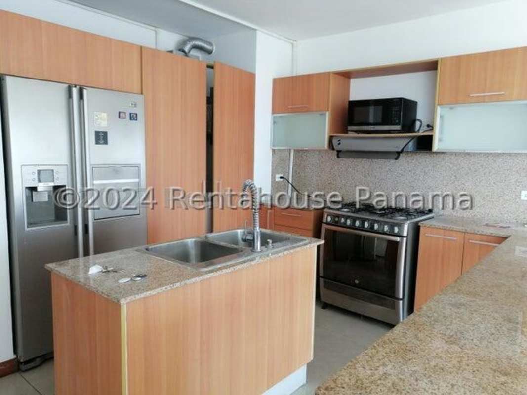 Modern bathroom with tiled shower and sink in PH Bahia del Golf Panama