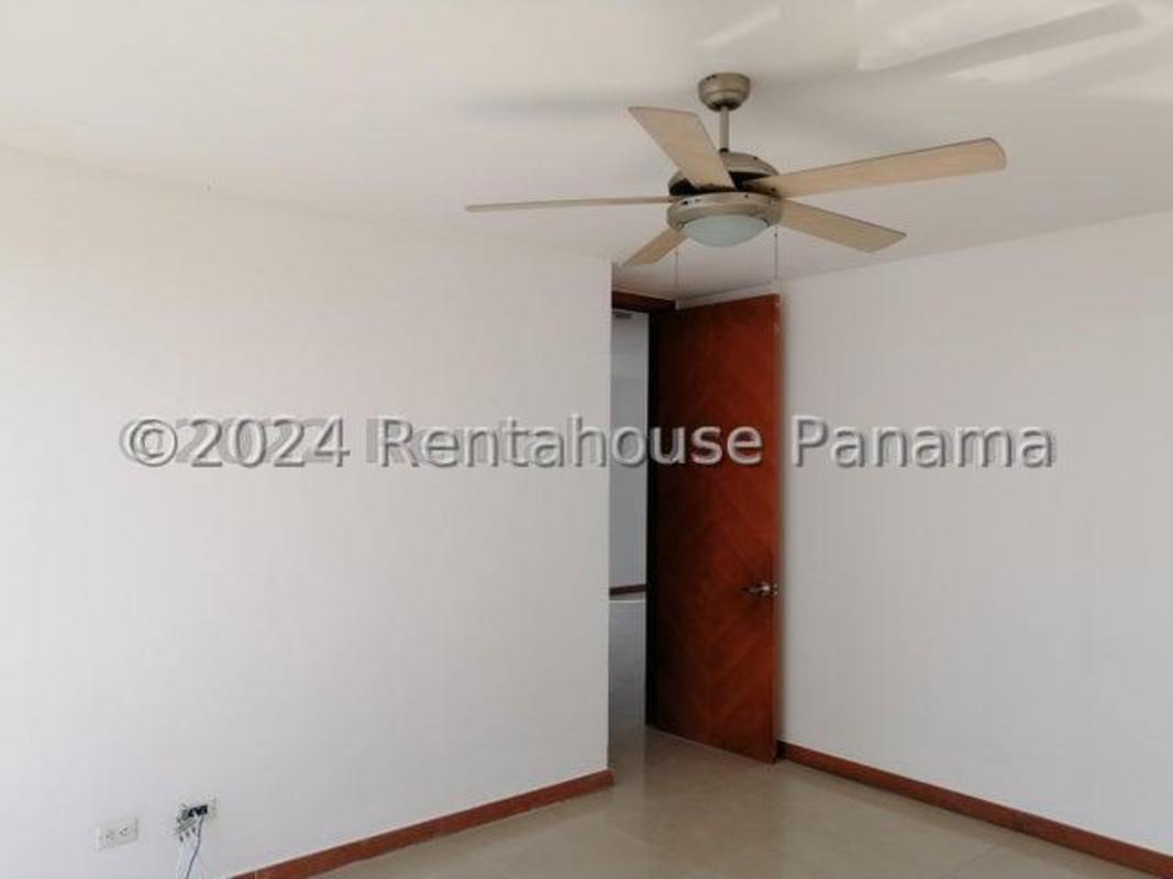 Kitchen with granite counters appliances and wood cabinets PH Bahia del Golf Coco del Mar Panama