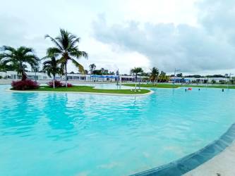 Master bedroom with queen bed AC sliding doors opening to garden in Villa Ibiza Beach Residence Coclé Panama