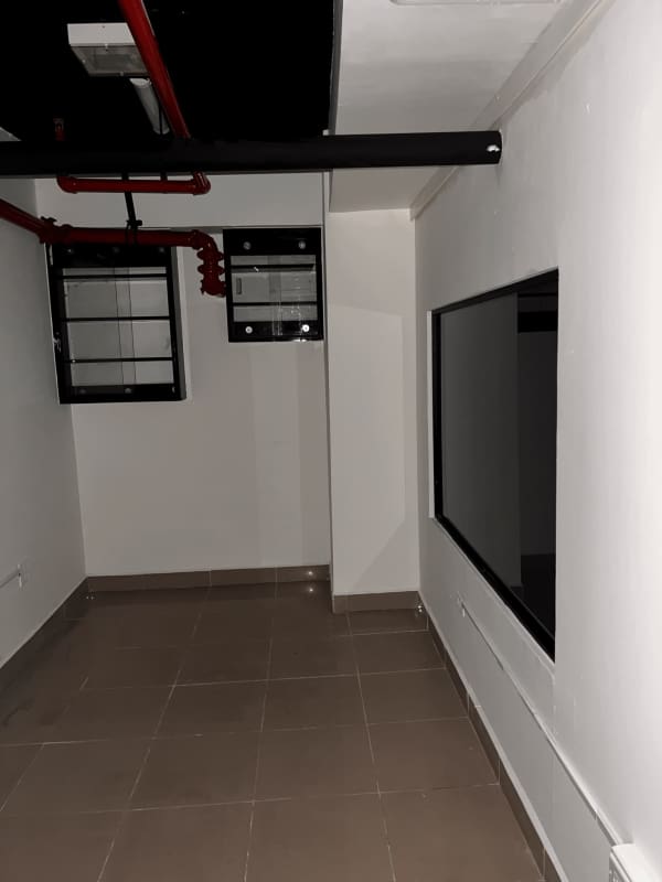 Office mezzanine level with railing inside commercial rental unit Los Andes Mall