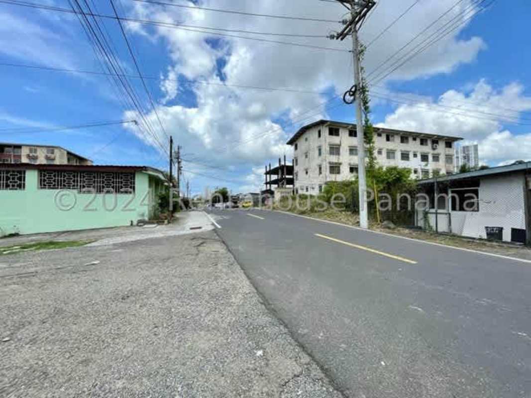 Urban flat lot bordered by paved roads and electric lines suitable for commercial residential construction