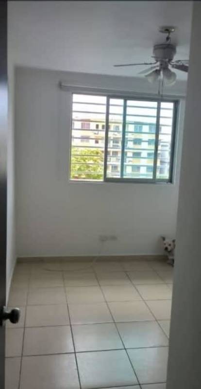 Bedroom interior with wardrobe and hallway exit inside PH Lefevre Park Panama City