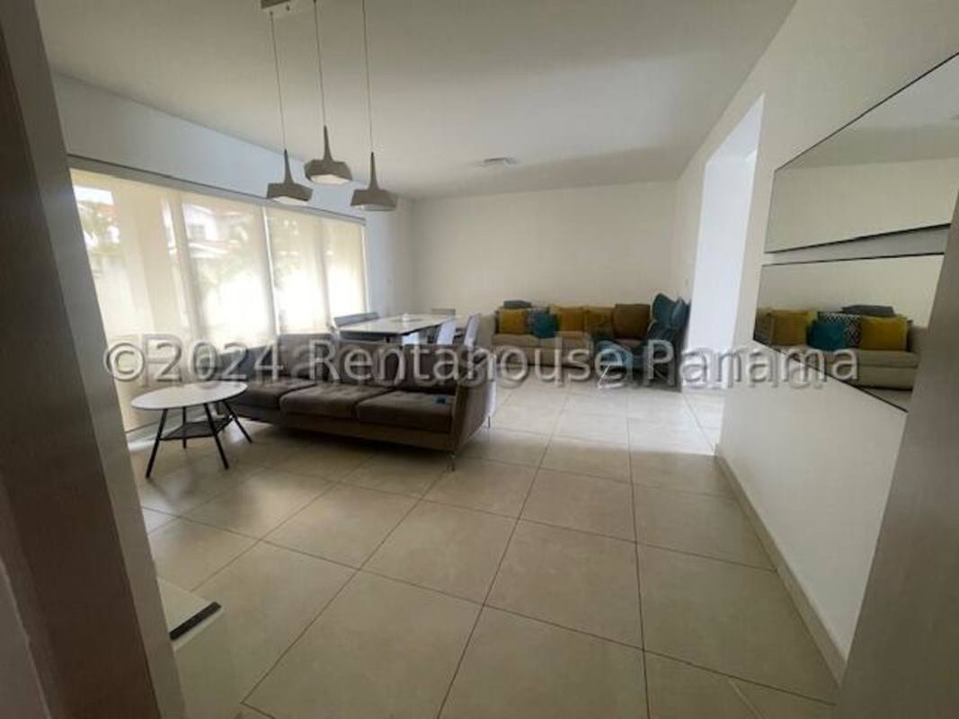 Bedroom with bed, desk, computer setup and tile floors in Residencial Versalles Costa Sur Panama