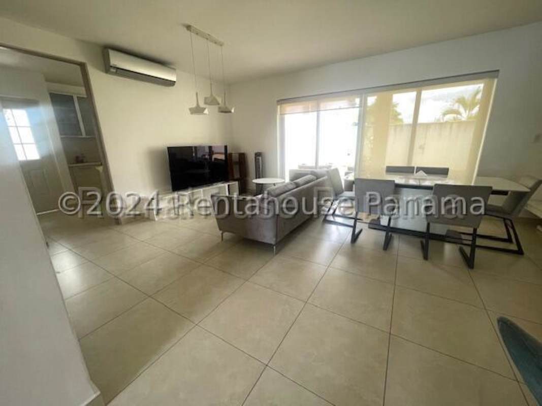 Spacious living and dining area with ceramic flooring, large windows, modern furniture in Versalles Costa Sur Panama