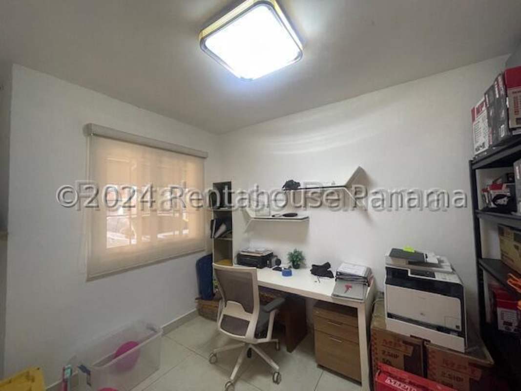 Covered rear terrace with outdoor seating and garden in Versalles Costa Sur Panama