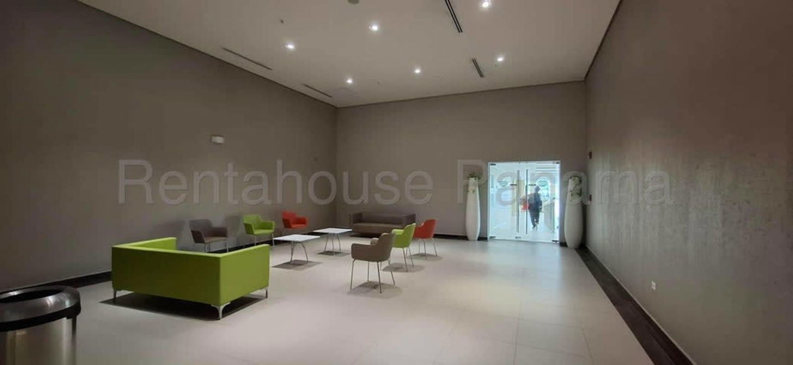 Interior retail corridor at Town Center Costa del Este with glass storefronts