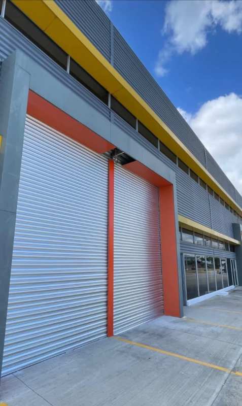 Modern commercial building exterior facade ample parking in Llano Bonito Panama City