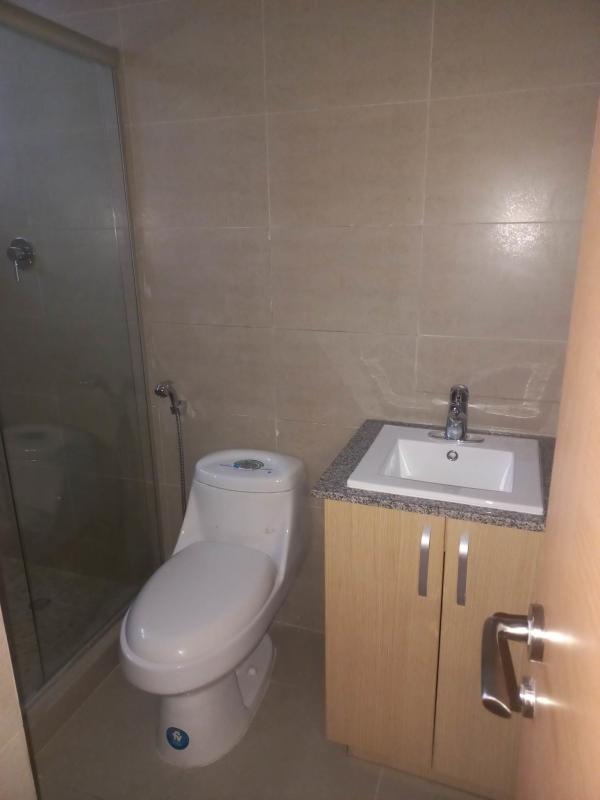 Contemporary bathroom with walk-in shower and tile in PH Villa de las Fuentes Panama