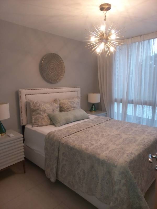 Second bedroom with closet and large window in PH Villa de las Fuentes Panama