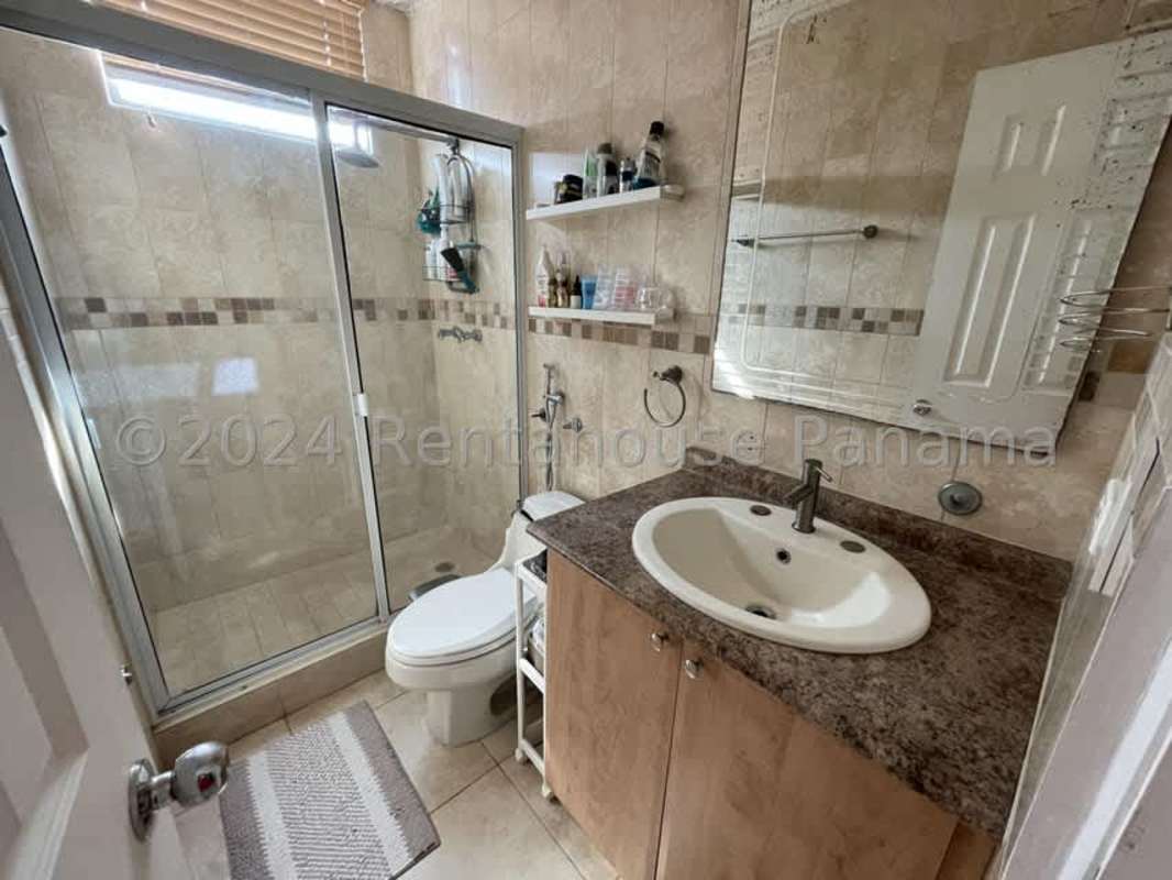 Second bedroom with built-in closet and city skyline view in PH San Francisco Bay Panama