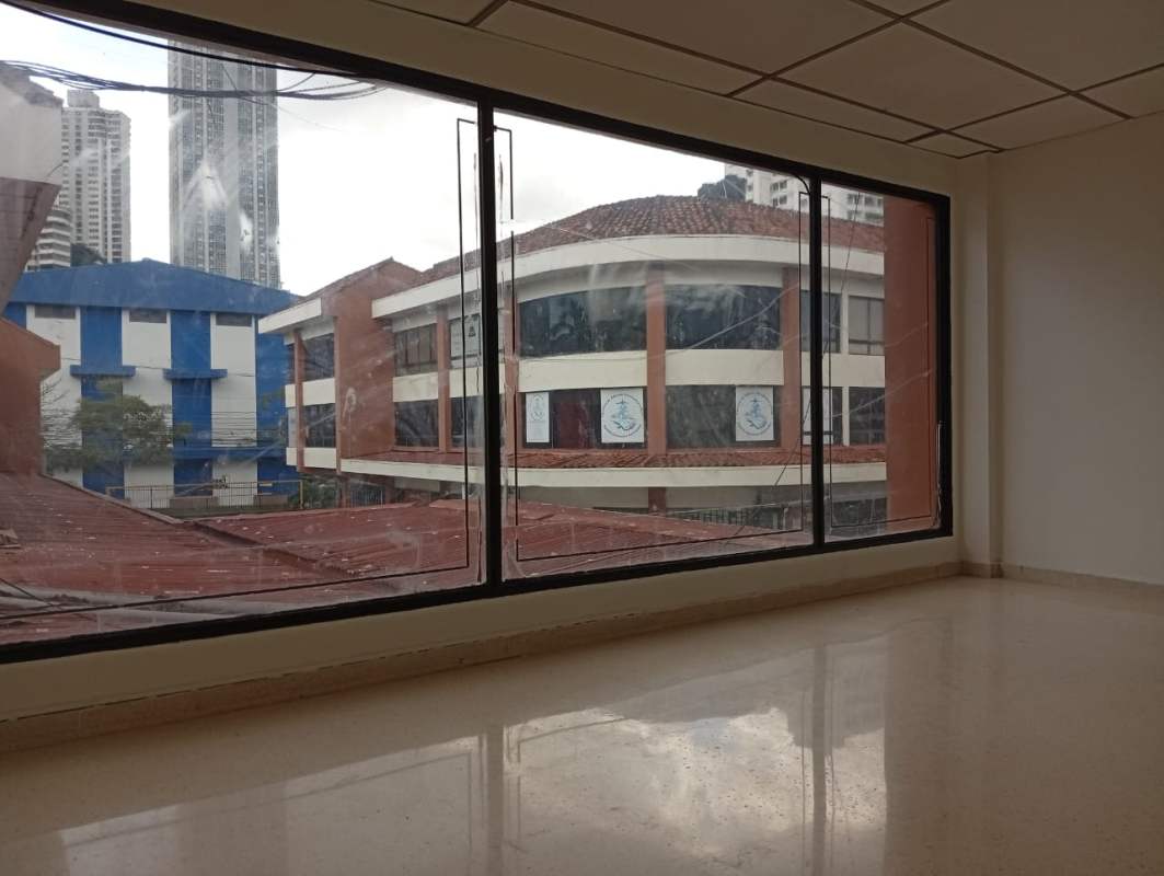 Office with panoramic window overlooking El Dorado district in Panama City