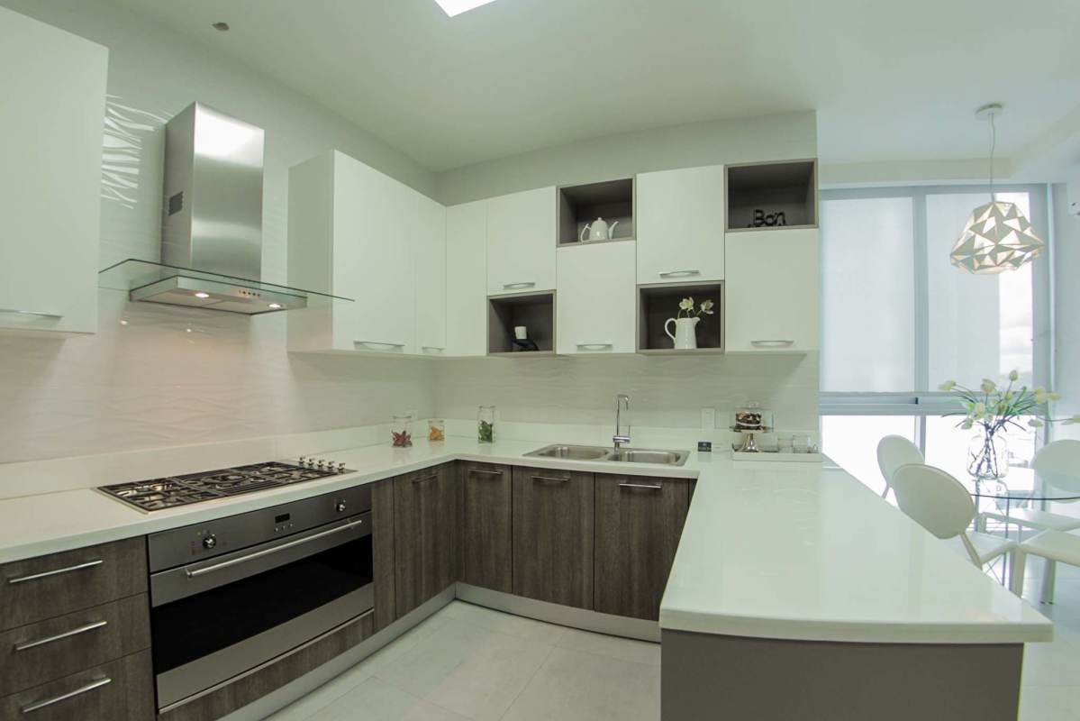 Modern kitchen with quartz countertops and built-in appliances PH Ocean House Costa del Este