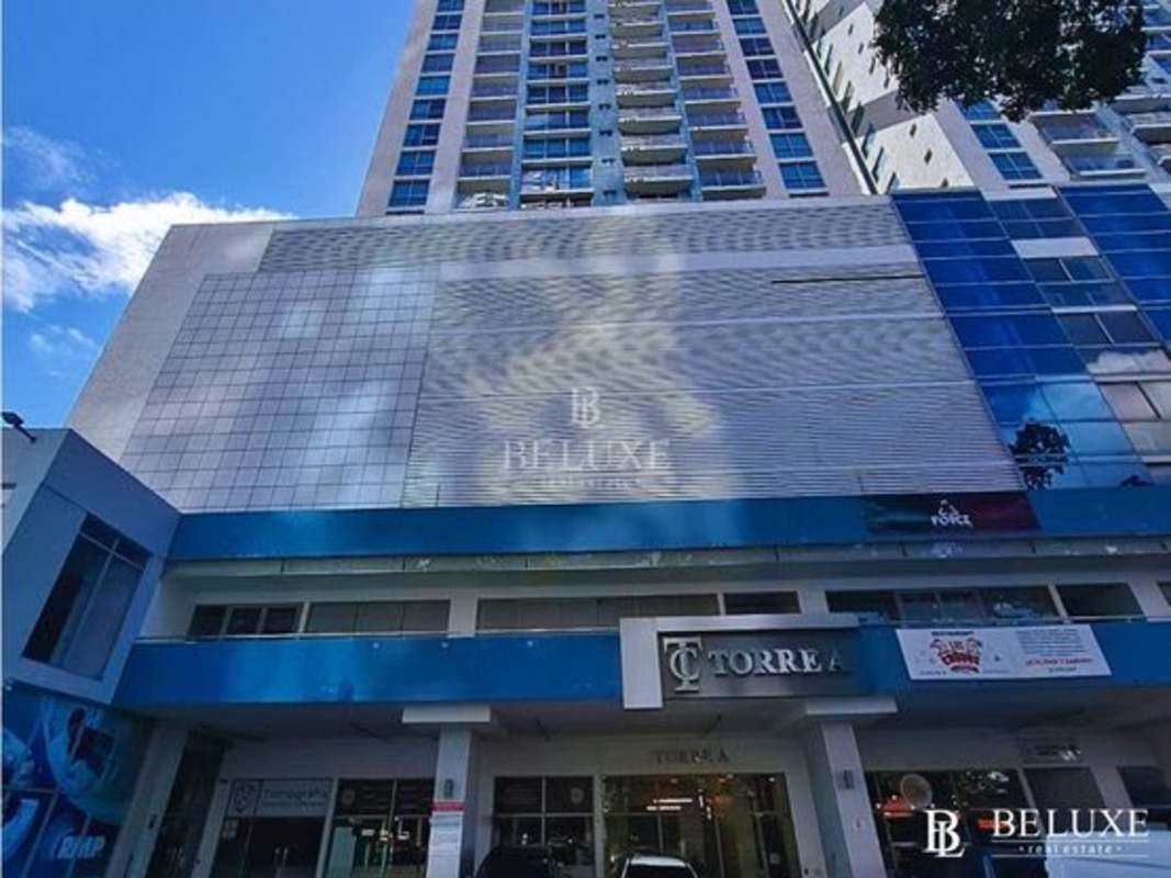 Bedroom with large window and skyline view at PH Torres de Castilla Panama City Panama