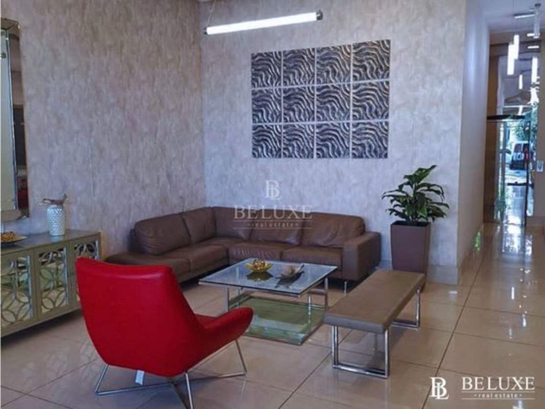 Bright bedroom with large windows and tile flooring at PH Torres de Castilla Panama City Panama