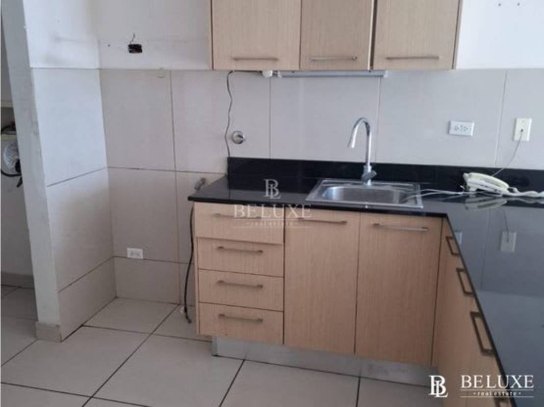 Bathroom with glass shower enclosure and beige wall tiles in PH Torres de Castilla Panama City