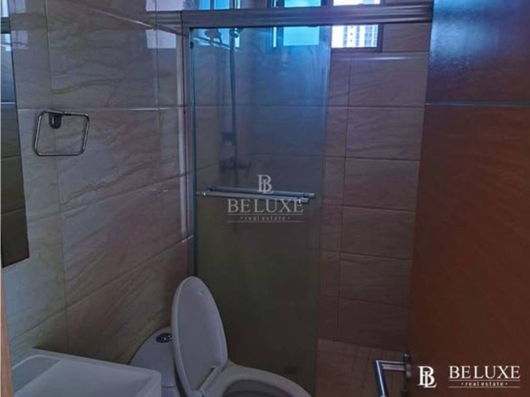 Open plan living area with floor-to-ceiling windows and balcony in PH Torres de Castilla Panama City