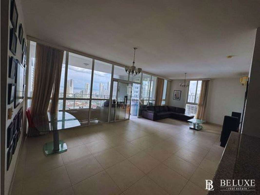 Bright living dining area with floor to ceiling windows PH Quadrat San Francisco Panama City