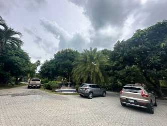 Driveway circular tropical landscaping and fountain in Punta Roca beachfront estate Panama