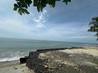 Open coastal beachfront view with ocean waves and tropical vegetation Punta Roca Panama