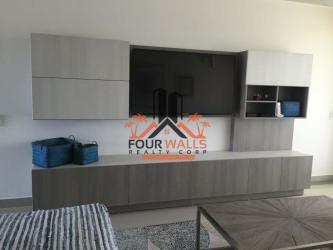 Apartment living room with built-in media unit TV and minimalist décor in PH Marina Golf San Carlos Panama