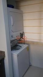 Compact laundry space with stacked appliances washer dryer PH Marina Golf Panama