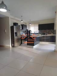 Bright modern kitchen with large window ceramic tiles PH River Village Panama Pacifico