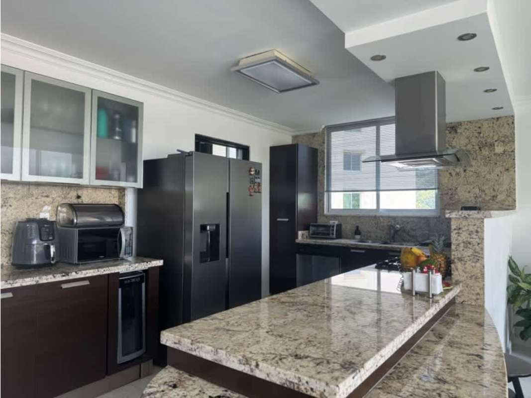 Living room with large windows, Christmas tree festive decor PH Pine Hills apartment Panama sale