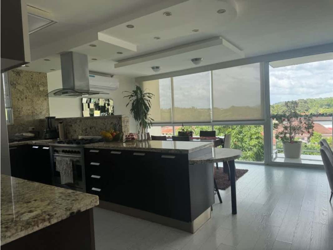 Open plan living and dining area modern decor balcony scenic view PH Pine Hills Albrook Clayton apartment