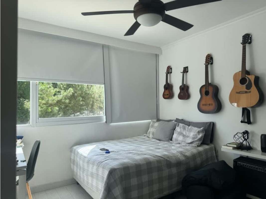 Modern kitchen with island granite countertops stainless steel appliances PH Pine Hills Clayton apartment