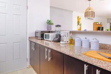 Guest bedroom with bunk bed and window in Coronado gated beach community