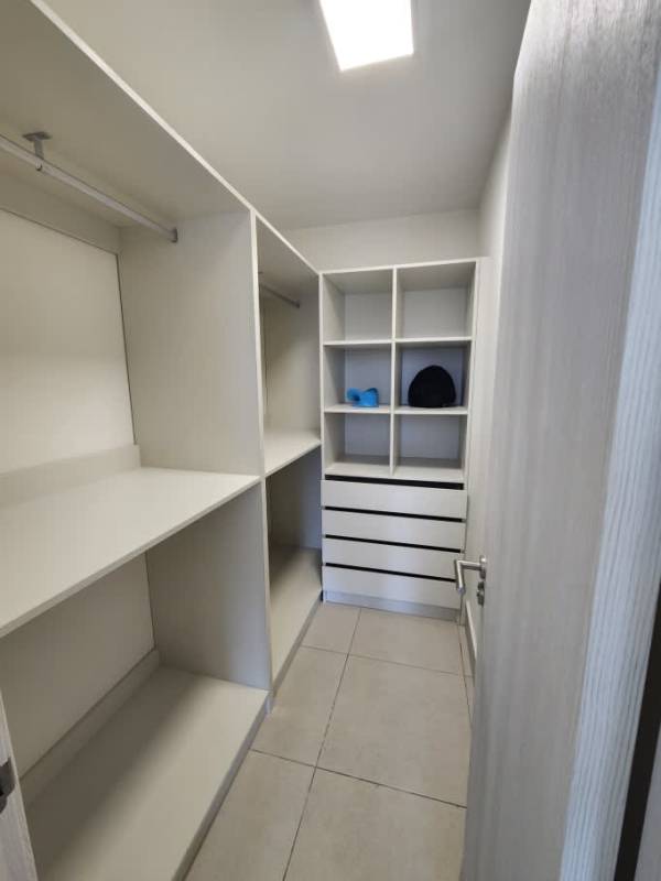 Walk-in closet with shelving and hanging space PH Coco Place rental Panama