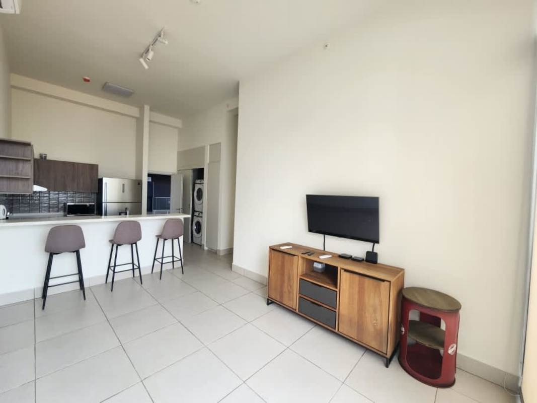 Open floor plan with kitchen, living area, breakfast bar in PH Coco Place Panama City