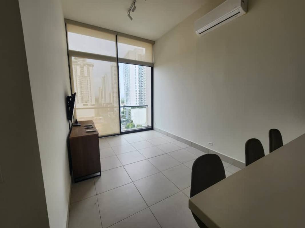 Open-plan living dining area with AC, large window PH Coco Place apartment rental Panama