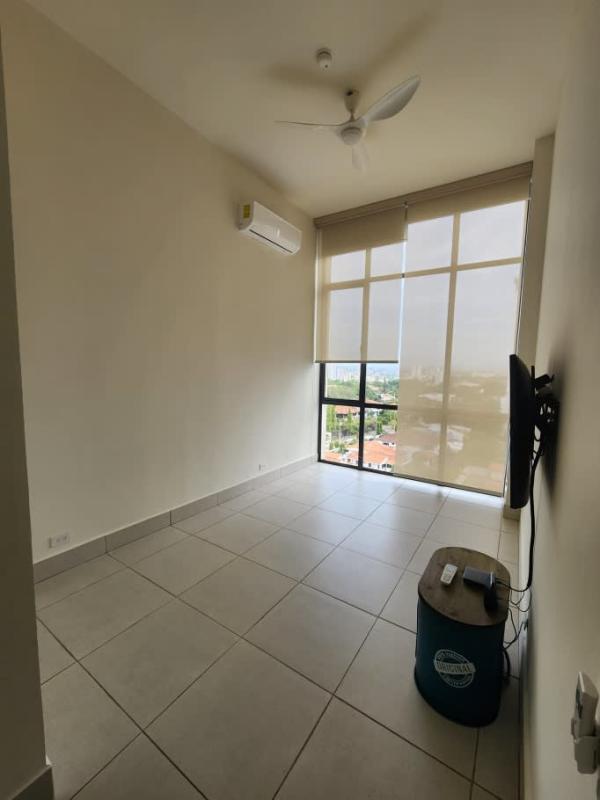 Living room with AC unit, ceiling fan, tile floor, balcony access PH Coco Place Panama