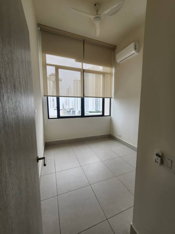 Bedroom with window overlooking skyline, AC, fan PH Coco Place Coco del Mar Panama