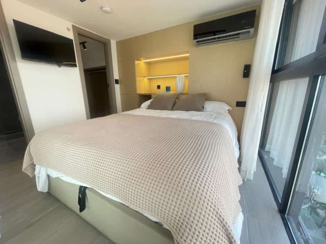 Bedroom with large window and ocean view in PH Serenity Coco del Mar Panama