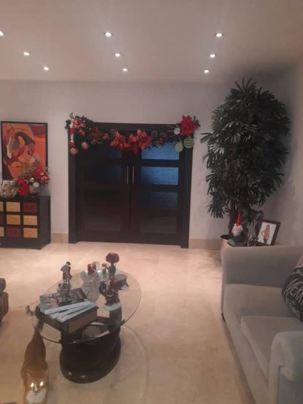 Large master bedroom with seating and AC in Panama City home for sale El Carmen