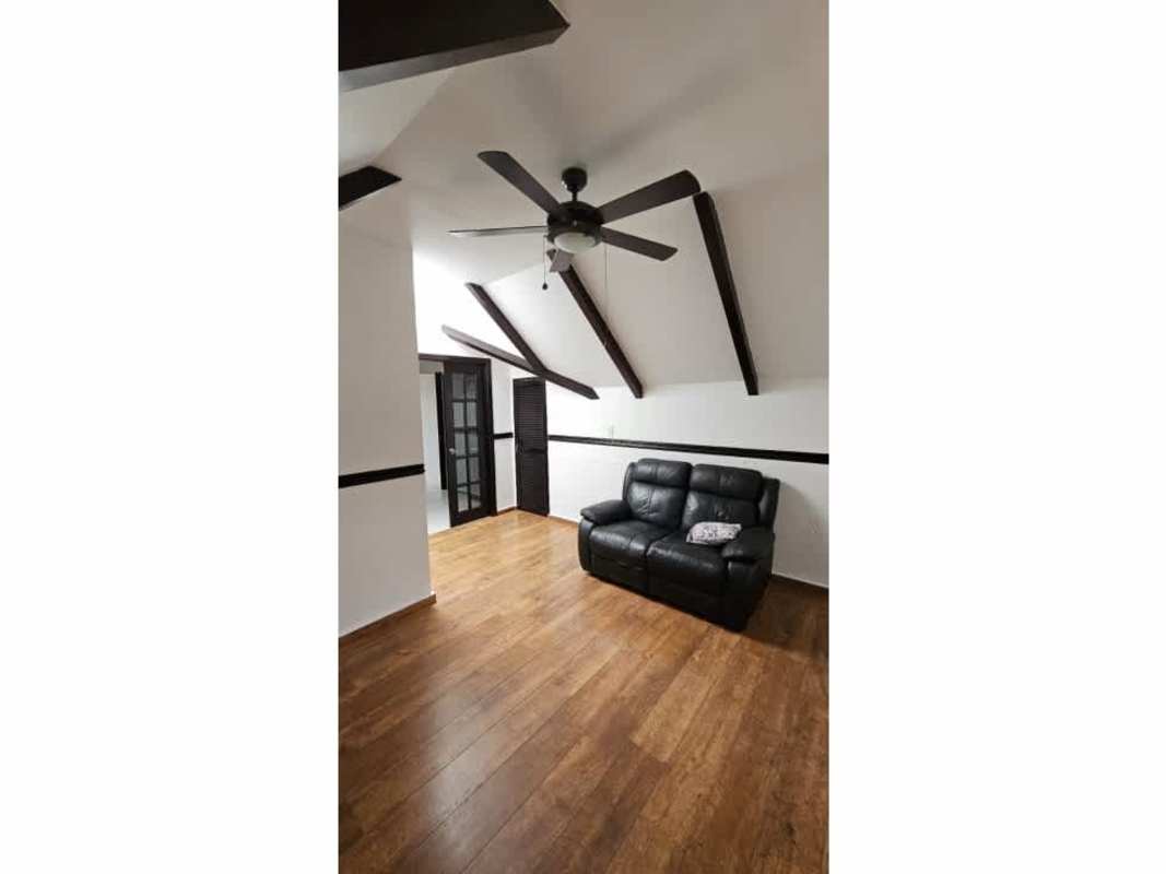 Attic loft with exposed beams, sloped ceiling, wood floors, AC in La Montañesa Panama City