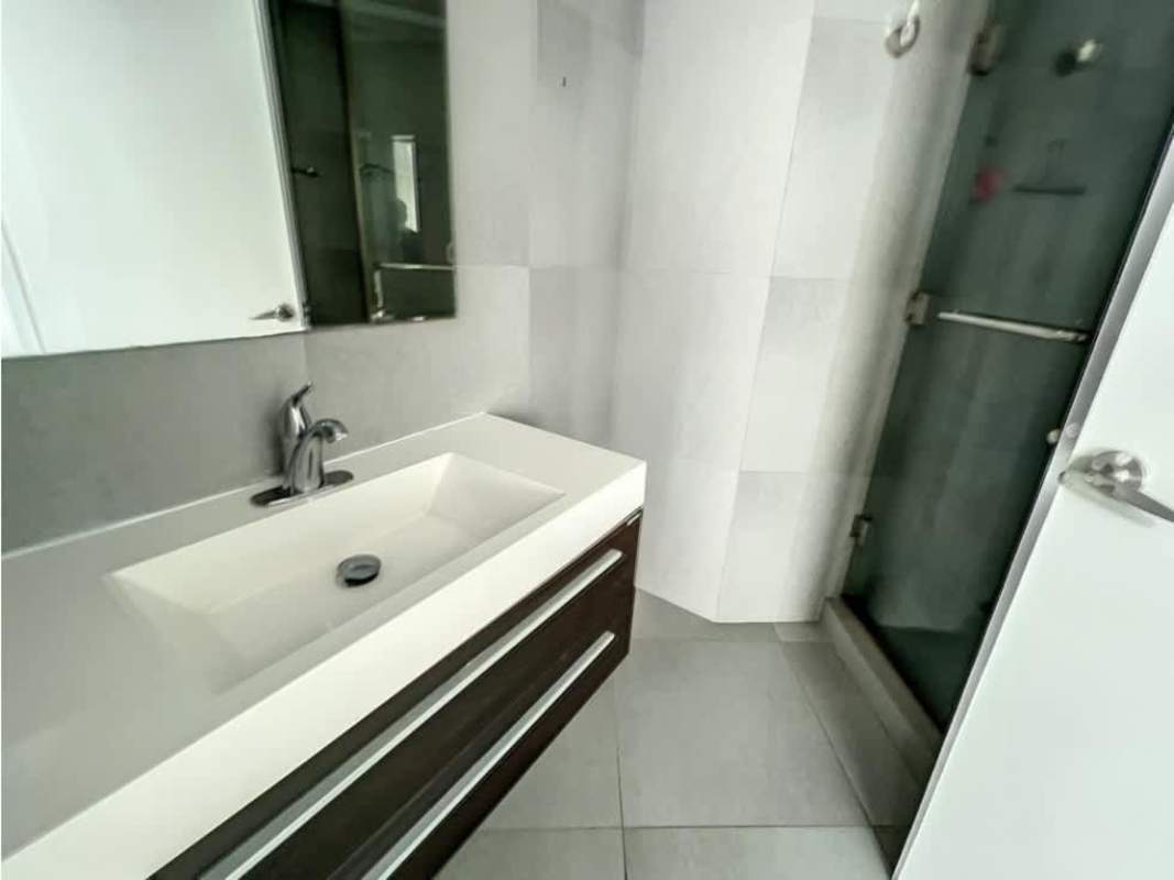 Open living dining area with panoramic windows overlooking ocean in PH Yacht Club Panama