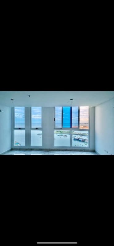 Living room with full height windows overlooking the bay at PH The Sands Panama City