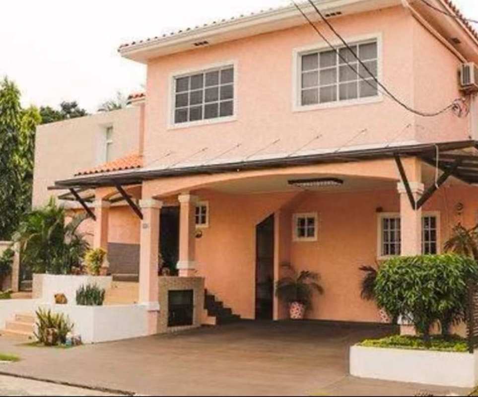 Peach-colored two-story home with covered carport, garden, in Fuente del Fresno Condado del Rey