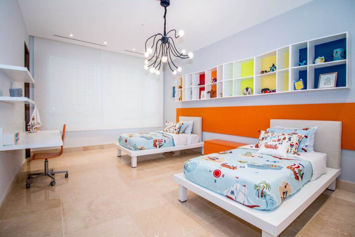 Spacious walk-in closet with custom shelves and island at PH Marea II Costa del Este Panama