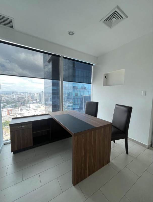 Modern office with L-shaped desk and two chairs with large windows Punta Pacifica