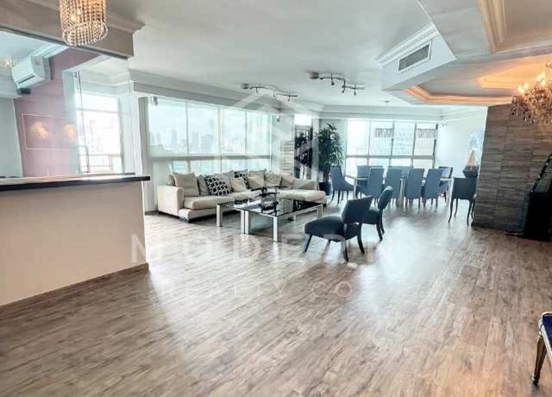 Spacious open-concept living and dining room with ocean and city views in PH Ocean Club Panama City