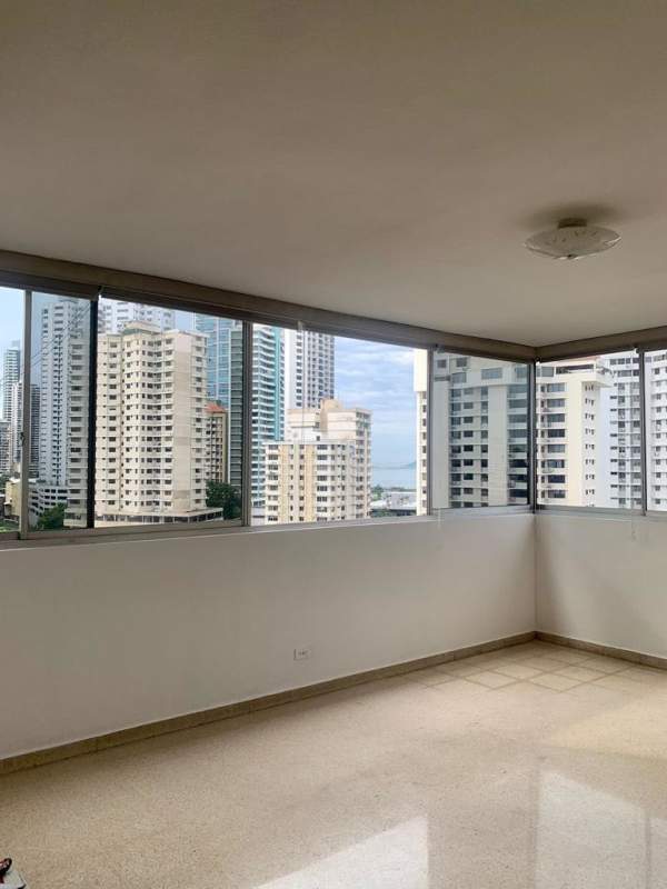 Spacious living room with large windows city view furnished apartment PH La Concha Marbella Panama