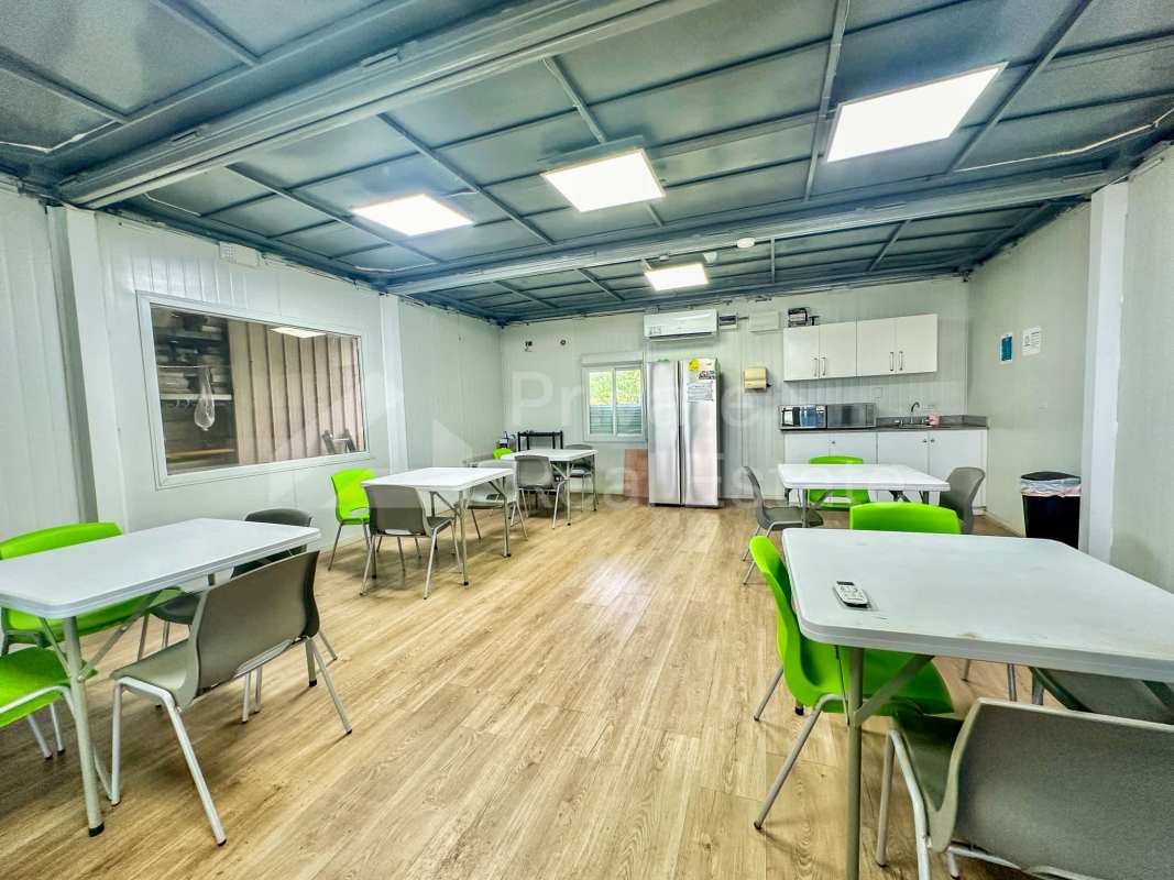 Office dining area with tables, fridge, kitchenette in commercial warehouse Panama