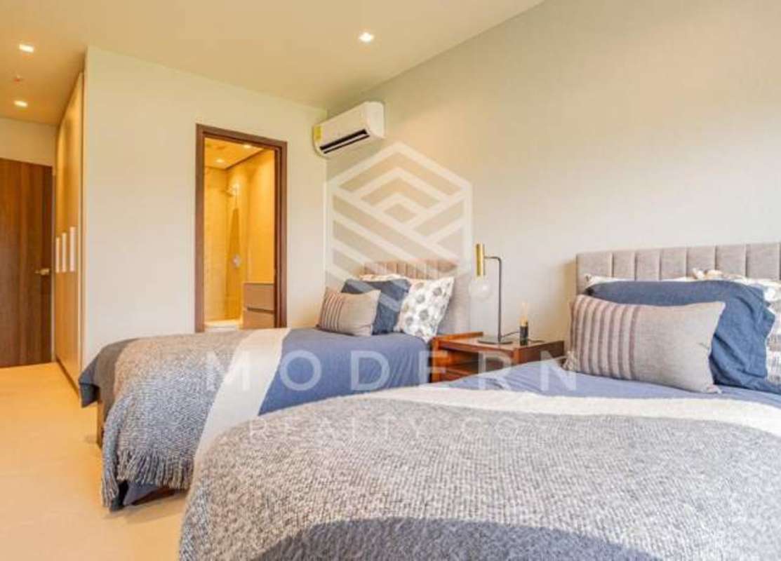 Bright bedroom with ensuite bathroom and large window in Santa Maria Panama