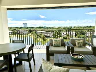 Dining space with lagoon and garden views in Buenaventura Laguna penthouse for sale