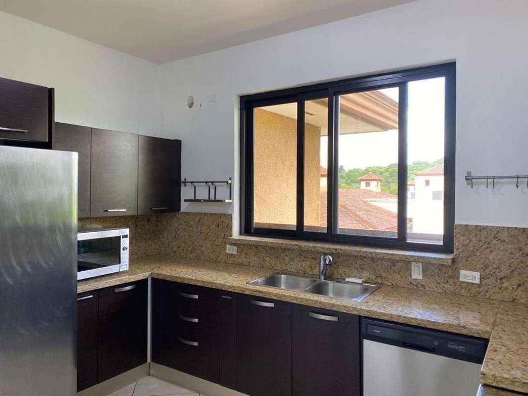 Guest bedroom furnished with large window and closet Embassy Club Clayton Panama