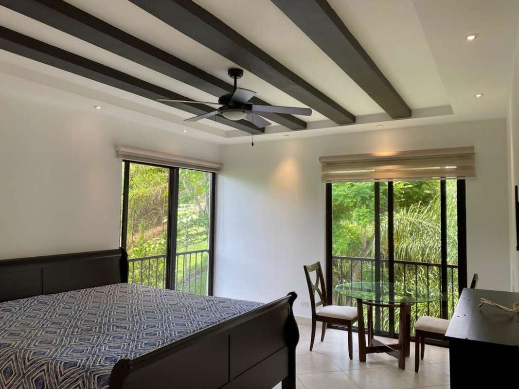 Private balcony with lush green garden views in Embassy Club Clayton Panama City apartment